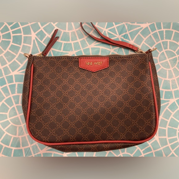 Nine West Handbags - 💛TODAY**$19**Nine West brown & red leather-like clutch w/removable wrist strap.